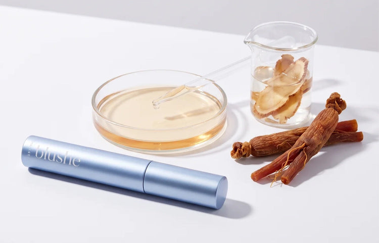 A Blushe tube beside a dish of serum, a beaker and ginseng roots